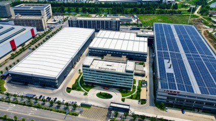 Aerial view of ZX SHOCK factory halls with rooftop solar panels